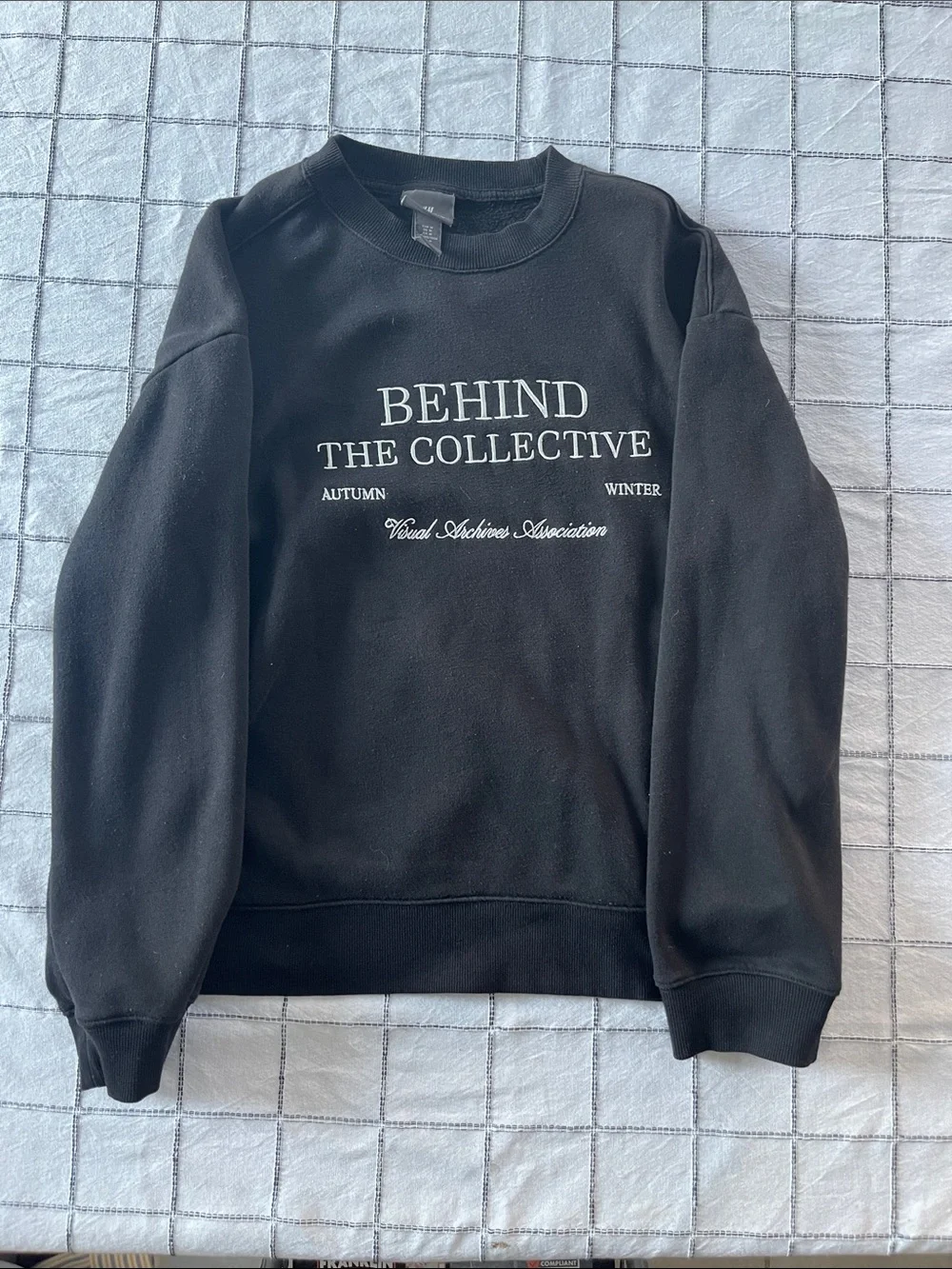 H&M Black Crewneck Sweatshirt with White 'Behind The Collective' Print